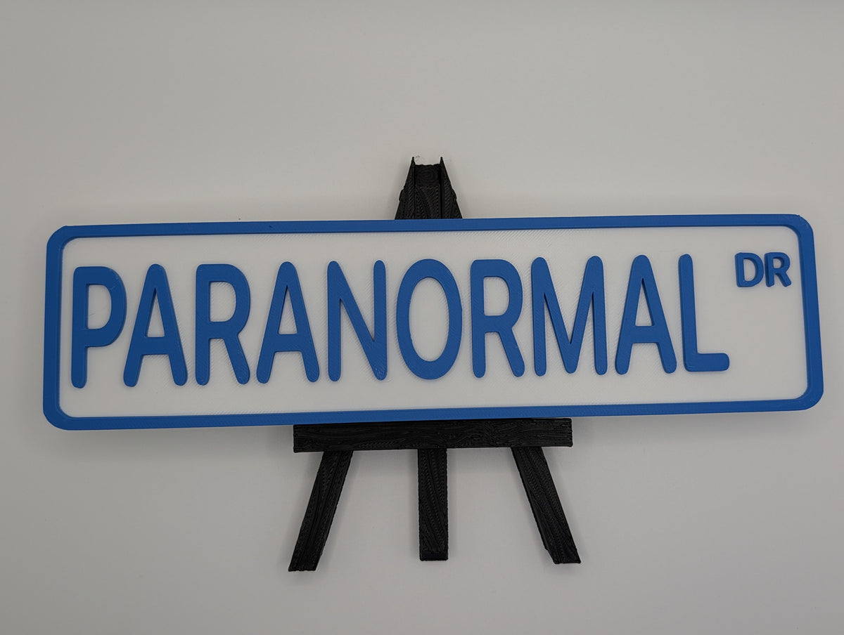 Blue Paranormal Street Sign