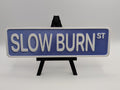 Purple Slow Burn Street Sign