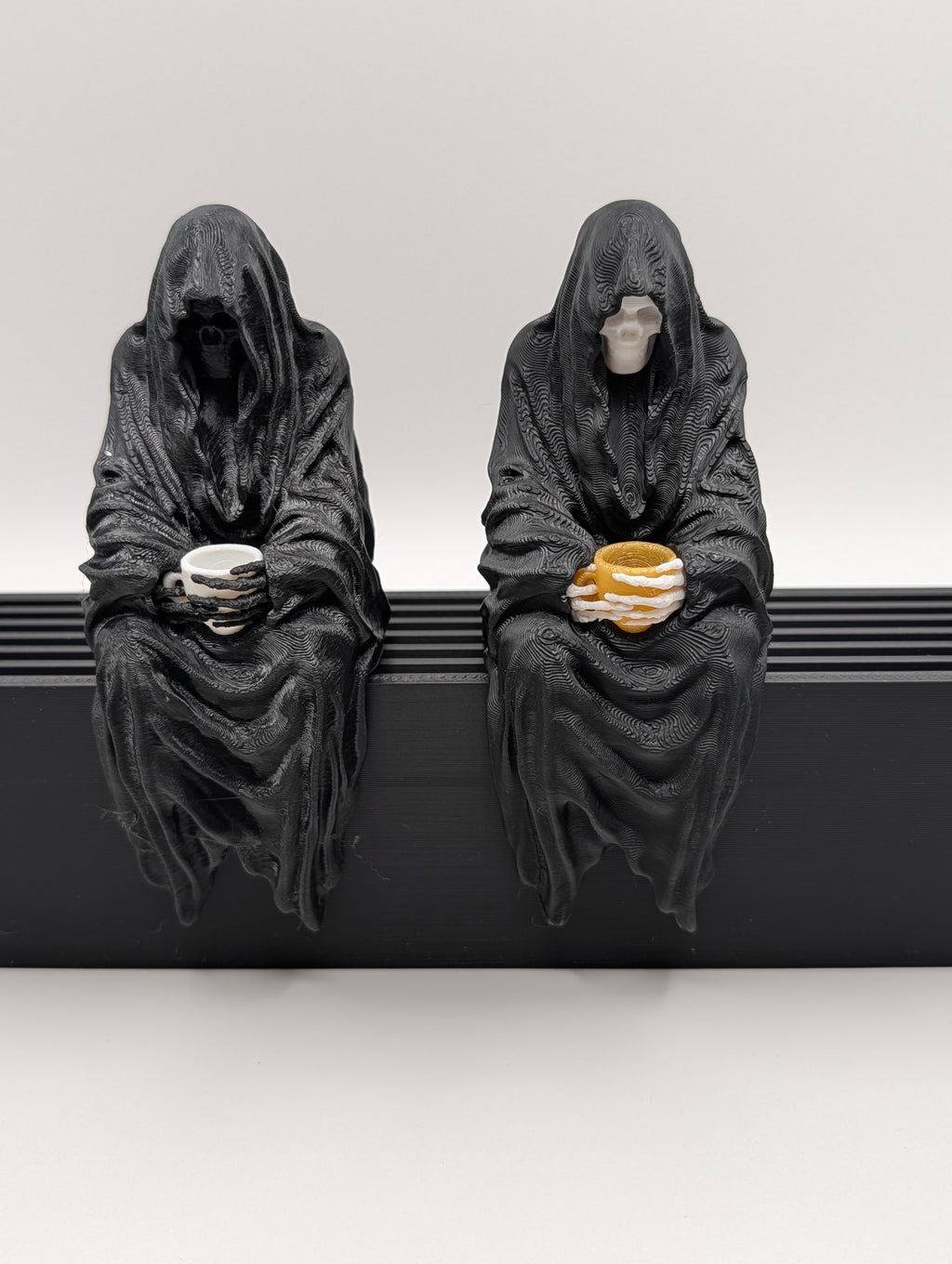Sitting Reaper with Teacup