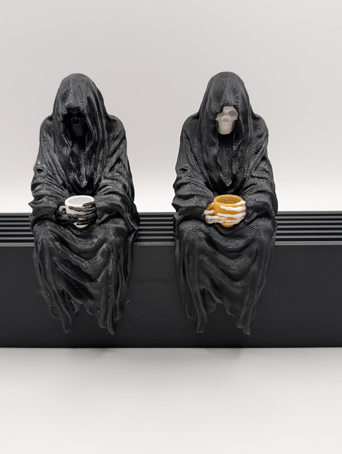 Sitting Reaper with Teacup